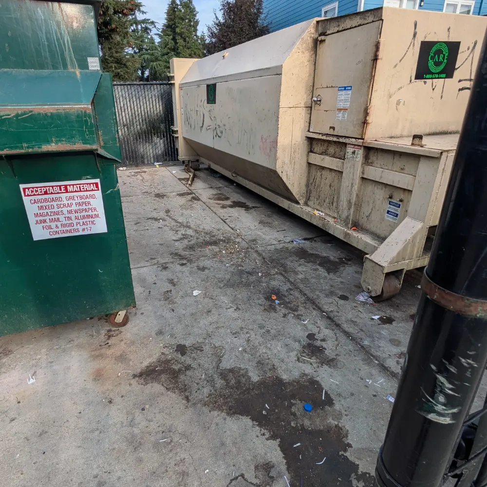 Clean Dumpster enclosure at apartment after Patriot Hauling and Junk Removal quick cleanup