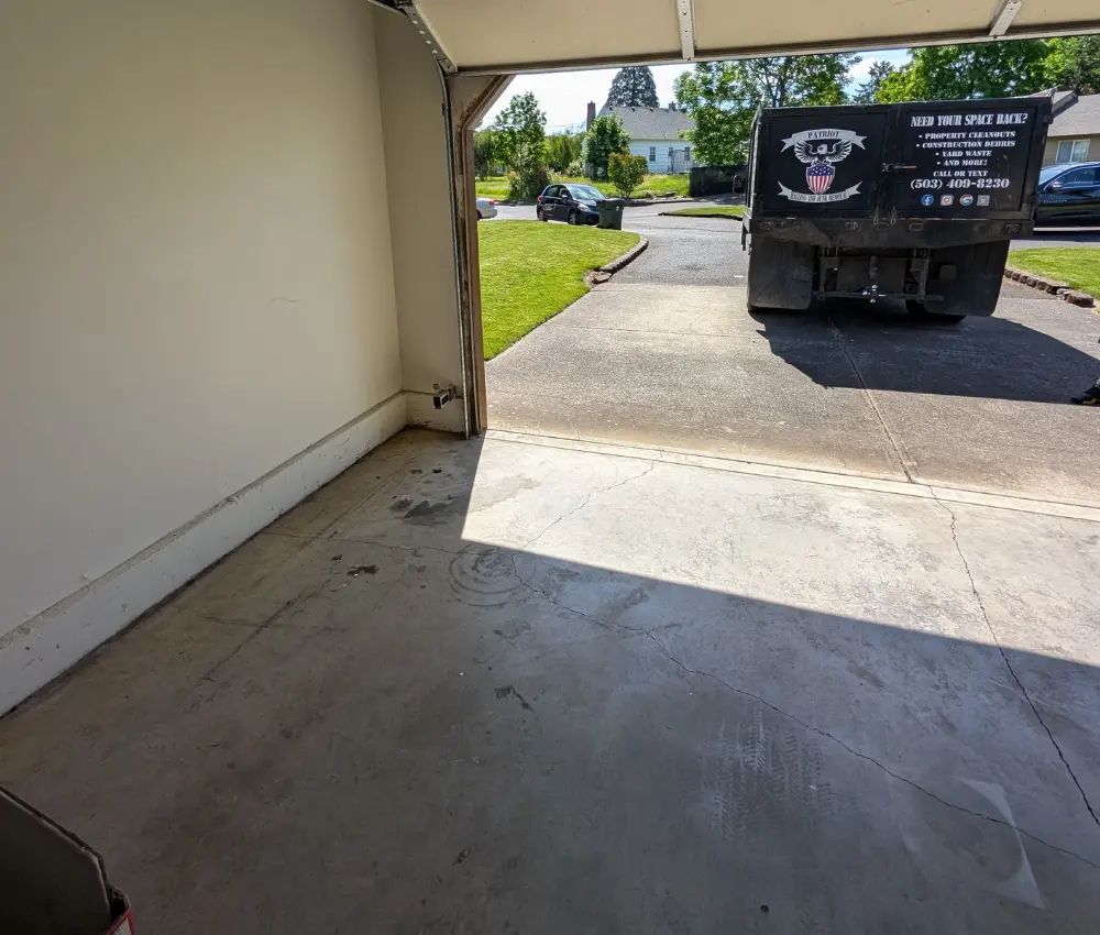 Empty garage after cleanup with patriot hauling and junk removal