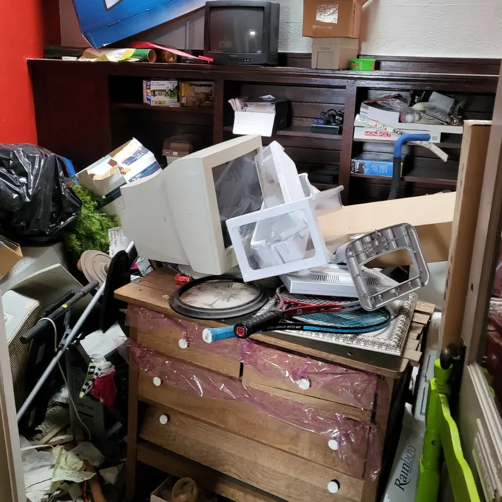 Sensitive hoarder cleanout with old electronics, furniture, and recyclables