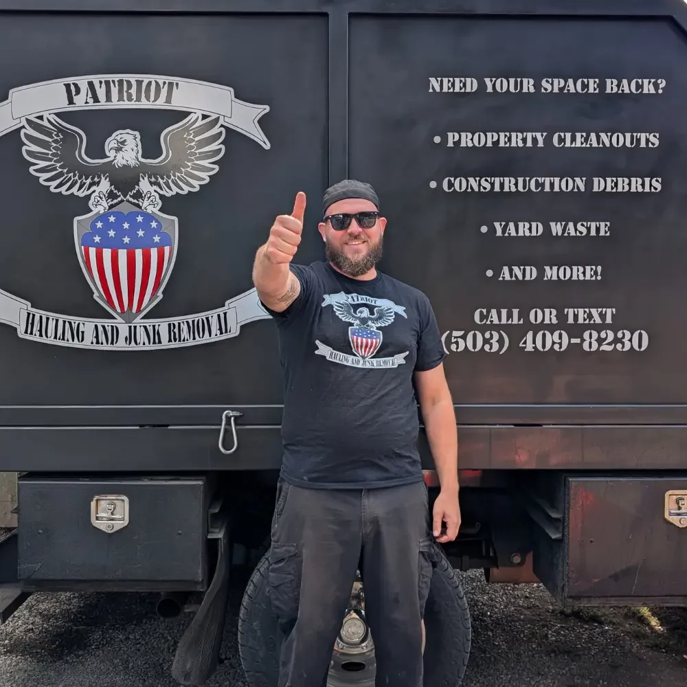 Owner Stanley Pygott in front of Patriot Hauling and Junk Removal truck in Salem, Oregon.